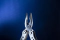 Multitools steel on blue background. advertising poster