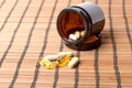Multivitamin Pills in a brown medicine jar