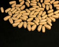 Multivitamin tablets sprinkled and a pills bottle . Selective focus Royalty Free Stock Photo