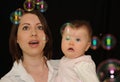 Mum and baby watching bubbles