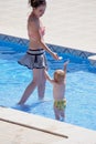 Mum and child in paddling pool Royalty Free Stock Photo