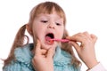 Mum cleans a teeth to a daughter