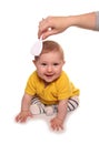 Mum combing baby girls hair