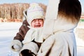 Mum with crying baby outside in cold Royalty Free Stock Photo