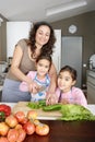 Mum and Daughter Chopping Veggies Royalty Free Stock Photo