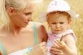 Mum with the doughter in the field Royalty Free Stock Photo