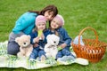 Mum embraces daughters on a picnic