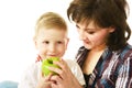 Mum feeding her son Royalty Free Stock Photo