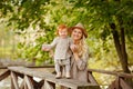 Mum gently embraces the redhead baby girl and laughing in autumn Royalty Free Stock Photo