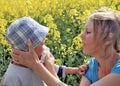 Mum helping her child blow his nose stock photo