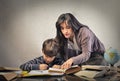 Mum helping his son with homework Royalty Free Stock Photo