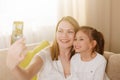 Mum and her cute daughter child girl are playing, smiling and hugging. Happy mother& x27;s day. Royalty Free Stock Photo