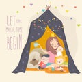 Mum and her kids playing in a tepee tent