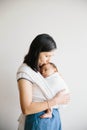 A mum holding her baby. Baby sleeping in sling. Royalty Free Stock Photo