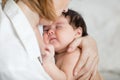 Mum holding her little child daughter. Baby falls asleep in the mother`s arms Royalty Free Stock Photo