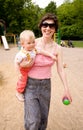 Mum and little daughter on a playground