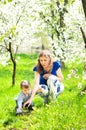 Mom plays with the small son on the grass Royalty Free Stock Photo