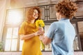 Mum receive flower as present from her son. Concept of mother day Royalty Free Stock Photo