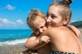 Mum with small son on beach Royalty Free Stock Photo