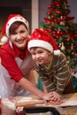 Mum and son having fun at christmas baking Royalty Free Stock Photo