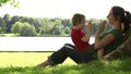 Mum and son playing under a tree