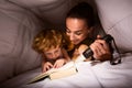 Mum and son reading exciting story Royalty Free Stock Photo
