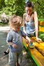 Mum and son together in park Royalty Free Stock Photo