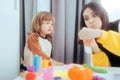 Mother and Daughter Playing with Plasticine Being Creative