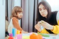 Mother and Daughter Playing with Plasticine Being Creative