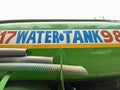 Low angle shot of a water tanker vehicle parked outside.