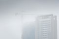 Fog enveloping a high rise building under construction during the monsoon in Mumbai