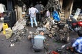 Mumbai/India - 22/11/14 - Car Breaker demolishing part of an engine in the Thieves Market, Mumbai Royalty Free Stock Photo