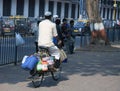 Mumbai/India - 24/11/14 - Dabbawala delivering out on a bicycle at Churchgate Railway Station Royalty Free Stock Photo