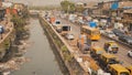 Mumbai, India - December 17, 2018: Dirty river in Dharavi slums. Mumbai. India. Royalty Free Stock Photo