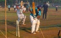 Unidentified boys practicing batting to improve cricketing skills at Mumbai ground