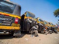 Mumbai, India - December 17, 2019: Yellow and green auto rickshaws in Indiya.