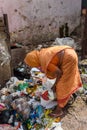 Indian woman sorting garbage in Dharavi Slum at Mumbai. India