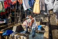 Indian woker washing clothes in Dhobi Ghat is outdoor laundry in Mumbai. India Royalty Free Stock Photo