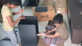 Children installing Ikea Lixhult storage unit at home. Ikea furniture comes with easy to install detail and easy to understand