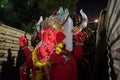 Mumbai, India - 20 september 2019: close up of red hindu god ganesha inside truck during Vinayaka Chaturthi festival celebration
