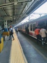 Mumbai local train station people railway going for job busy