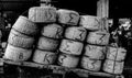 Heap of Baskets made from bamboo cane stocked on the hand cart in the fish market. Royalty Free Stock Photo