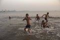 Mumbai, Maharashta / India - May 21 2020: Young children bathing and playing with friends group