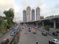 Vehicles moving on the national highway within the big metropolis.