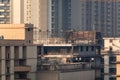 A building under construction in a dense, high rise residential neighbourhood in the