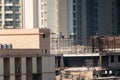 Mumbai, Maharashtra, India - January 2021: A building under construction in a dense, high rise residential neighbourhood in the