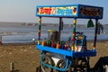 Mumbai, Maharashtra - India january 9, 2022 : vendor sells lemonade, soda and soft drinks out of a simple blue cart.