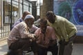 Mumbai, Maharashtra, India- 05-10-2019. Men of different religion checking cricket score in a mobile phone. Unity in diversity. Royalty Free Stock Photo