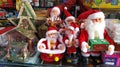 Cute little santa toys at a kid`s shop. Baby to old Santa Claus.