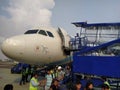 Front side nose of an airplane standing on the runway. Boarding on the flight.